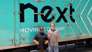 Next-moving-professional-local-movers-in-Burbank-California-standing-at-the-front-of-Next-Moving-truck-1920x1080.jpg  