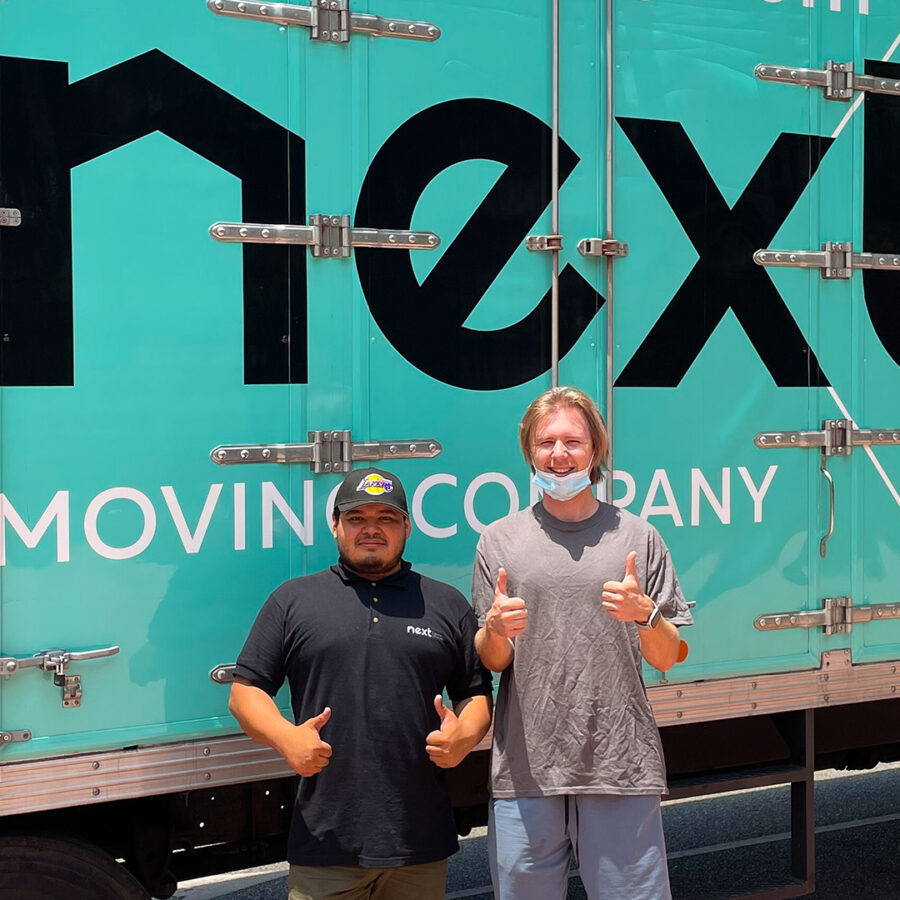 Next-moving-professional-local-movers-in-Burbank-California-standing-at-the-front-of-Next-Moving-truck-1920x1080.jpg